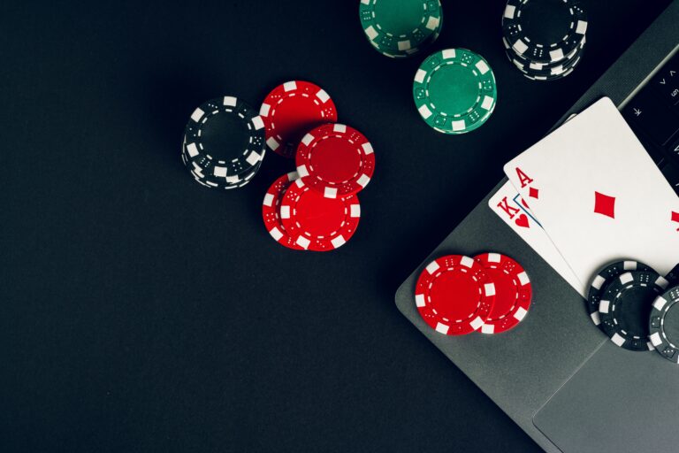 Poker chip and playing cards, symbolizing online gambling.