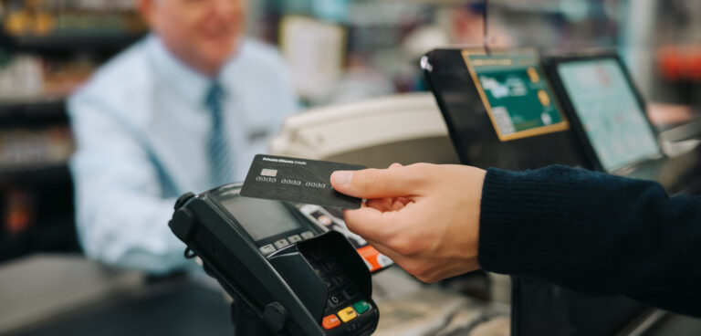 Paying with a credit card in a store.